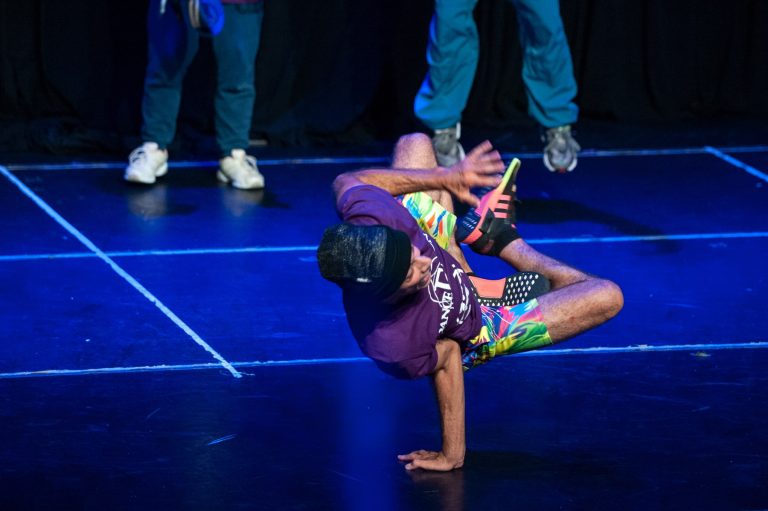 A person doing a handstand on the floor